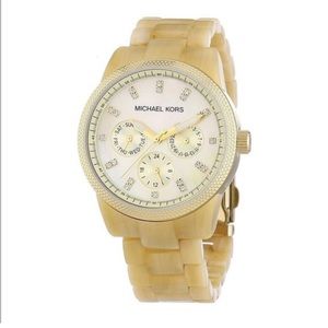 Michael Kors women’s cream gold tan watch. 
Collection:
Horn Jet Set
BAND